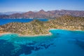 Aerial view of the rugged coastline of Crete and the clear waters of the Aegean Sea