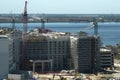 Aerial view of ruined by hurricane Ian construction crane on high apartment building site in Port Charlotte, USA