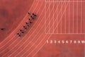 Aerial view of a running track with a group of runners. Royalty Free Stock Photo