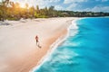 Aerial view of the running young woman on the sandy beach Royalty Free Stock Photo