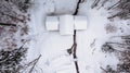 Aerial view of rural house covered with snow. Winter icy landscape, fresh stream,trees from above.Winter background of snow and Royalty Free Stock Photo