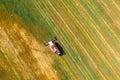 Aerial View Of Rural Landscape. Combine Harvester Working In Field, Collects Seeds. Harvesting Of Wheat In Late Summer Royalty Free Stock Photo