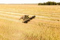 Aerial View Of Rural Landscape. Combine Harvester Working In Field, Collects Seeds. Harvesting Of Wheat In Late Summer. Royalty Free Stock Photo