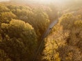 Aerial view of rural road with black car in yellow and orange au Royalty Free Stock Photo