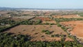 Aerial view of a rural road surrounded by Mediterranean forests at sunset Royalty Free Stock Photo