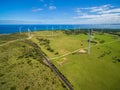 Aerial view of rural road and wind farm in Australia. Royalty Free Stock Photo