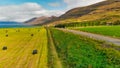 Aerial view of rural traditional house and farm field at small village in Svalbardseyri near Akureyri, Iceland