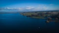 Aerial view of Rutland Water reservoir lake at sunset and foggy. Royalty Free Stock Photo