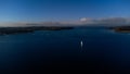 Aerial view of Rutland Water reservoir lake at sunset and foggy. Royalty Free Stock Photo