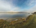Aerial view of Rutland Water reservoir lake at sunset and foggy. Royalty Free Stock Photo