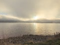 Aerial view of Rutland Water reservoir lake at sunset and foggy. Royalty Free Stock Photo