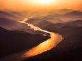 aerial view of s shaped bend river over layered mountains Royalty Free Stock Photo