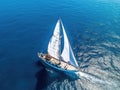 Aerial view of a sailboat sailing in the ocean