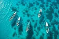 aerial view of sailboats on clean blue water revealing what\'s underwater