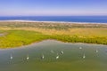 Aerial view of sailboats on river next to ocean in Saint Augustine