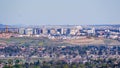 Aerial view of the San Jose downtown skyline on a clear day; residential neighborhoods visible in the foreground; south San