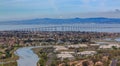 Aerial view of San Mateo Hayward bridge across the San Francisco Bay and Foster City in San Mateo County, California