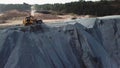 Aerial view of sand mining site conveyor with professional equipment at work. Stock footage. Flying above stone quarry Royalty Free Stock Photo