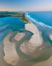 Aerial view of sand patterns in the shallow waters of the ocean inlet