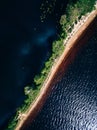 Aerial view of the sand spit with forest. Summer landscape with a blue lake in Finland Royalty Free Stock Photo