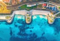 Aerial view of sandy beach, blue sea, restaurants at sunset Royalty Free Stock Photo