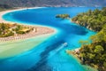 Aerial view of sandy beach, blue sea and speed boat at sunrise Royalty Free Stock Photo