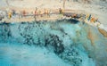 Aerial view of sandy beach with colorful canoes and blue sea Royalty Free Stock Photo