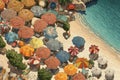 Aerial view of sandy beach with colorful umbrellas, swimming people in sea bay with transparent blue water in summer Royalty Free Stock Photo