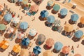 Aerial view of sandy beach with colorful umbrellas, swimming people in sea bay with transparent blue water in summer Royalty Free Stock Photo