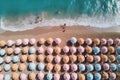 Aerial view of sandy beach with colorful umbrellas, swimming people in sea bay with transparent blue water in summer Royalty Free Stock Photo