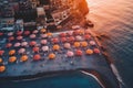 Aerial view of sandy beach with colorful umbrellas, swimming people in sea bay with transparent blue water in summer Royalty Free Stock Photo