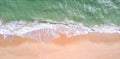 Aerial view of sandy beach and ocean with beautiful clear turquoise water. Royalty Free Stock Photo