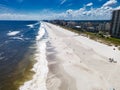 Aerial view of the sandy beach with people having a rest