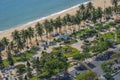 Aerial view of a sandy beach with sea water and coconut palm trees in the resort town of Nha Trang Vietnam Royalty Free Stock Photo