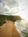 Aerial view from a sandy beach at the sunset with an amazing cliff Royalty Free Stock Photo