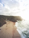 Aerial view from a sandy beach at the sunset with an amazing cliff Royalty Free Stock Photo