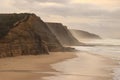 Aerial view from a sandy beach at the sunset with an amazing cliff Royalty Free Stock Photo