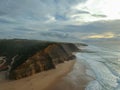 Aerial view from a sandy beach at the sunset with an amazing cliff Royalty Free Stock Photo