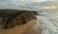 Aerial view from a sandy beach at the sunset with an amazing cliff Royalty Free Stock Photo