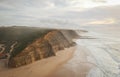 Aerial view from a sandy beach at the sunset with an amazing cliff Royalty Free Stock Photo