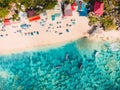 Aerial view of sandy beach with turquoise sea water and local tradition boats, drone shot Royalty Free Stock Photo