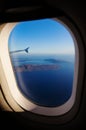 Aerial view of Santorini island as seen from plane window Royalty Free Stock Photo