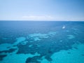 Aerial view of sardinia shoreline with boat and crystal clear blue turquoise sea - Mari pintau