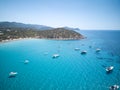 Aerial view of sardinia shoreline with boat and crystal clear blue turquoise sea - Mari pintau - Painted Sea TRAVEL in SARDINIA