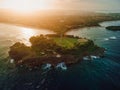 Aerial view of coastline with islands, warm sunset sunshine and ocean in Bali, Nusa Dua