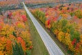 Scenic highway in Michigan upper peninsula surrounded with fall foliage Royalty Free Stock Photo