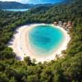 Aerial view of sea bay, sandy beach with umbrellas, trees, mountain at sunny day in summer. Blue lagoon in Oludeniz, Royalty Free Stock Photo