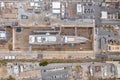 Aerial view of sea dry dock in La Ciotat city, France, the cargo crane, boats on repair, a luxury sail yacht and motor
