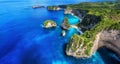 Aerial view at sea and rocks. Azure water background from top view. Panoramic seascape. Kelingking beach, Nusa Penida, Bali, Indon