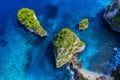 Aerial view at sea and rocks. Blue water background from top view. Summer seascape from air. Atuh beach, Nusa Penida, Bali, Indone